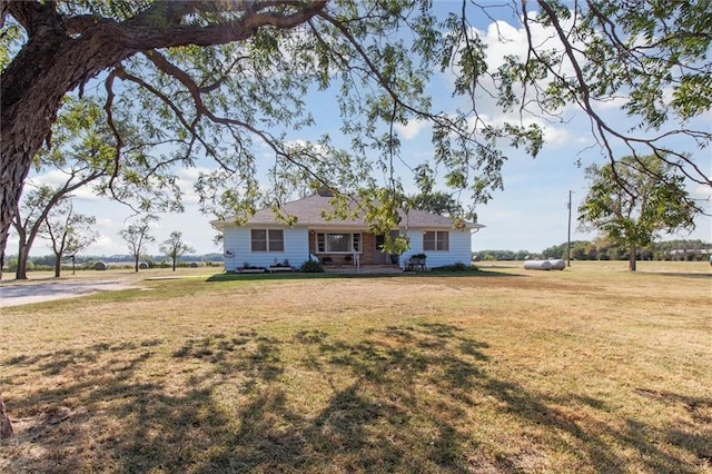 ranch-style home with a front lawn