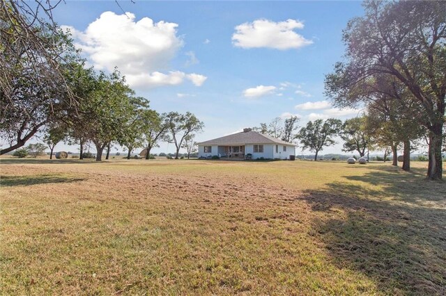 view of yard with a rural view