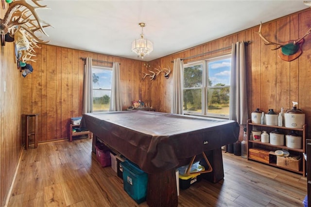 game room featuring wood walls, pool table, and hardwood / wood-style flooring