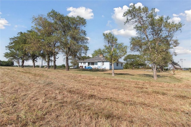 view of yard with a rural view