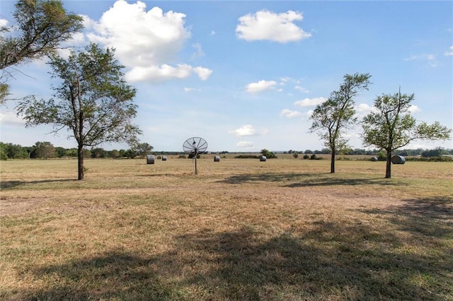 view of yard with a rural view