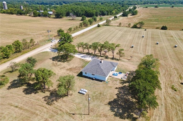 birds eye view of property with a rural view