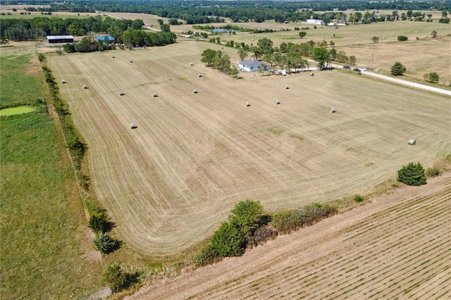 birds eye view of property with a rural view