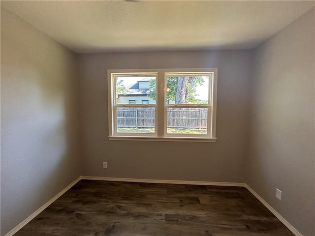 spare room with wood-type flooring