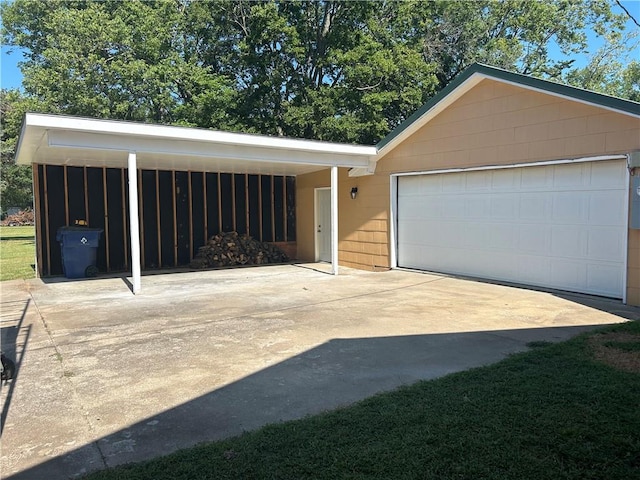 garage featuring a carport