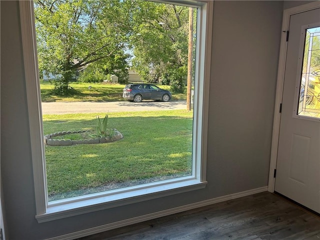 doorway to outside featuring dark hardwood / wood-style floors