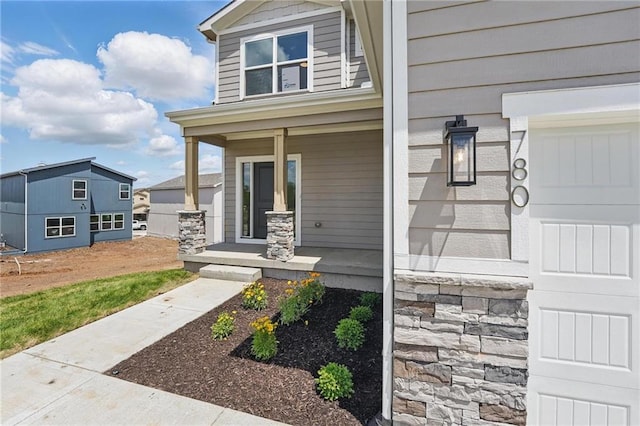 780 Creekmoor Dr, Raymore, MO 64083 - view of front of house with a porch and stone siding