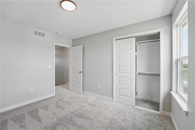 780 Creekmoor Dr, Raymore, MO 64083 - unfurnished bedroom featuring a closet, carpet, and baseboards