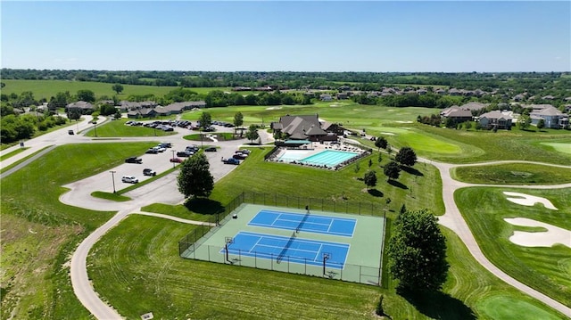 780 Creekmoor Dr, Raymore, MO 64083 - drone / aerial view of a golf course and a pool