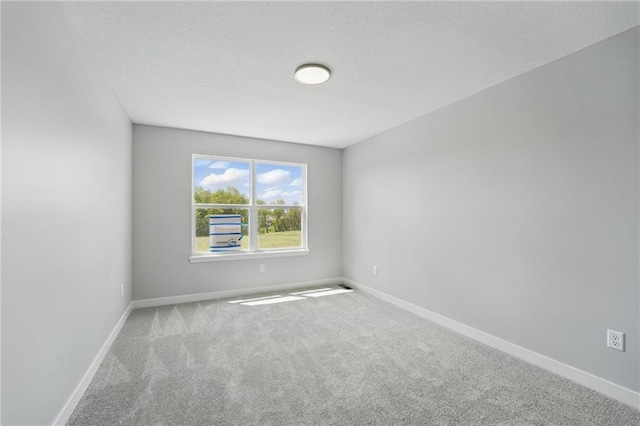 780 Creekmoor Dr, Raymore, MO 64083 - empty room featuring carpet floors and baseboards