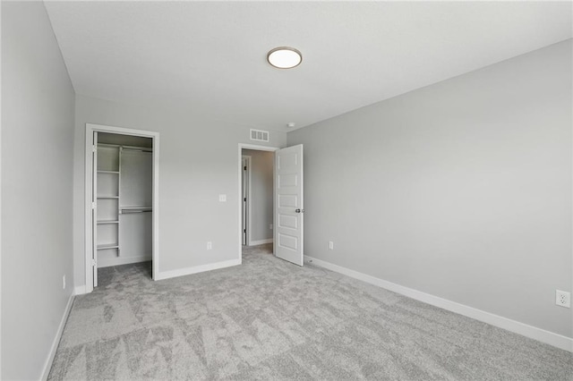 780 Creekmoor Dr, Raymore, MO 64083 - unfurnished bedroom featuring carpet floors, baseboards, and a spacious closet
