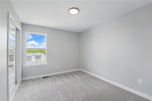 780 Creekmoor Dr, Raymore, MO 64083 - spare room with carpet floors and baseboards