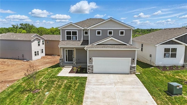 780 Creekmoor Dr, Raymore, MO 64083 - view of front of property with driveway, a front lawn, a garage, a shingled roof, and stone siding