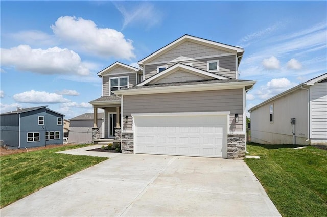 780 Creekmoor Dr, Raymore, MO 64083 - view of front facade with a front lawn, stone siding, and concrete driveway