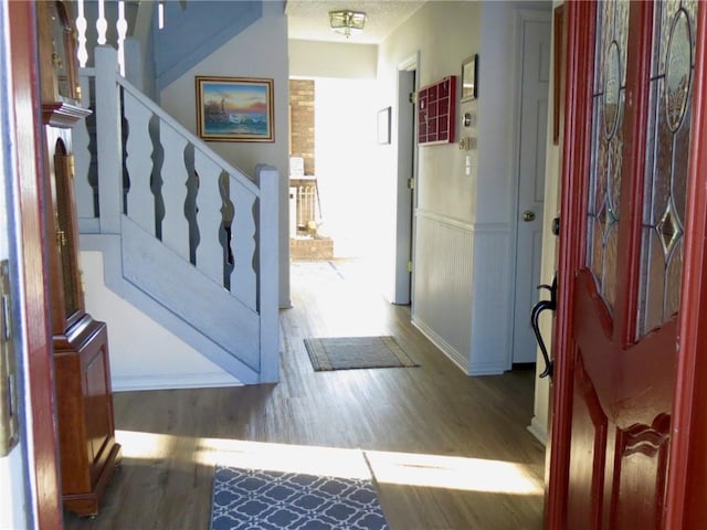 foyer entrance featuring dark hardwood / wood-style floors