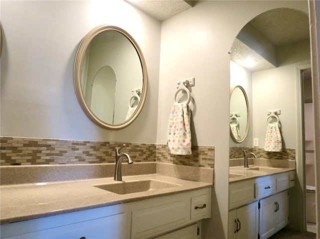 bathroom featuring vanity and a textured ceiling