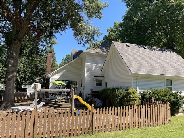 view of side of home with a playground