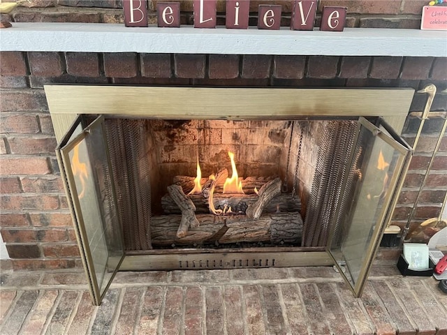 details featuring a brick fireplace