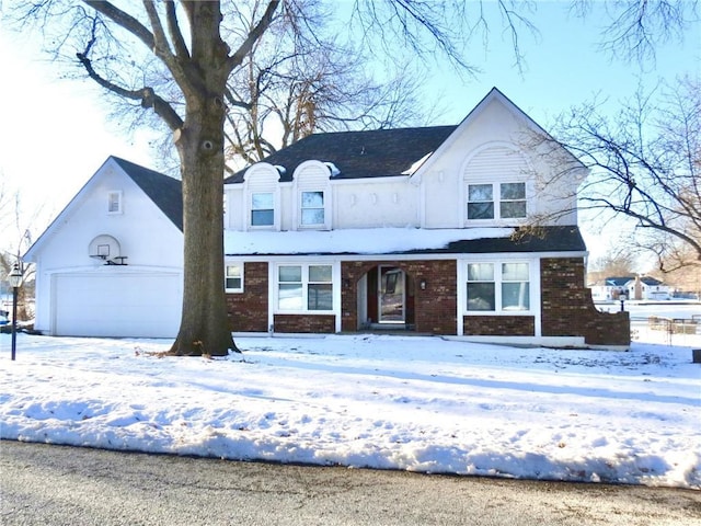 view of front facade featuring a garage and brick siding