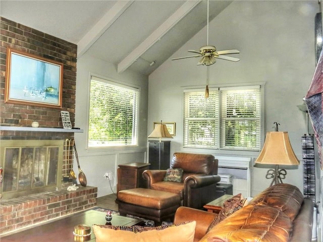 1005 Johnston Dr, Raymore, MO 64083 - living room with ceiling fan, beamed ceiling, a brick fireplace, and high vaulted ceiling