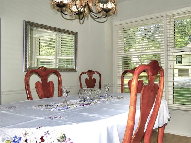1005 Johnston Dr, Raymore, MO 64083 - dining area with a chandelier