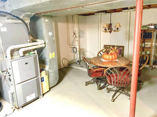 1005 Johnston Dr, Raymore, MO 64083 - unfinished below grade area featuring heating unit