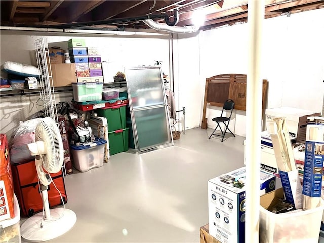1005 Johnston Dr, Raymore, MO 64083 - unfinished basement with freestanding refrigerator