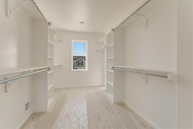 walk in closet with carpet and visible vents