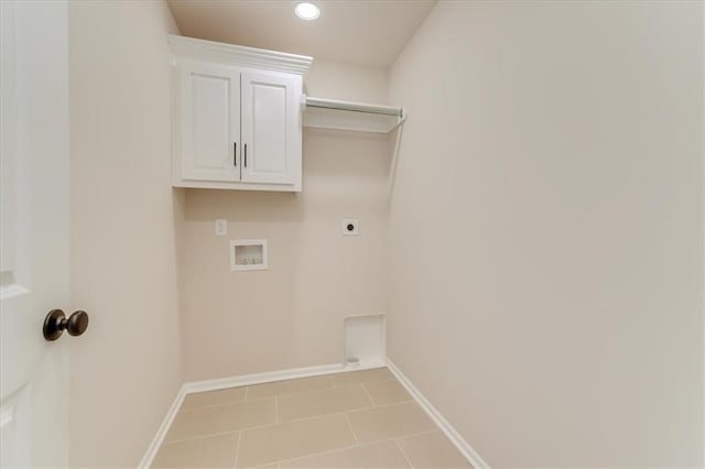 clothes washing area with baseboards, washer hookup, cabinet space, and hookup for an electric dryer