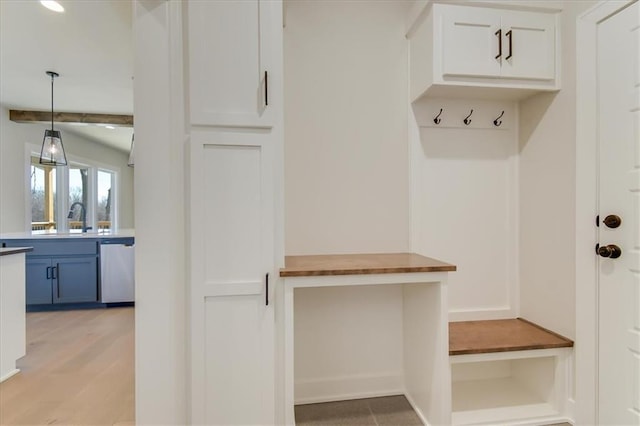 mudroom with a sink and light wood-style flooring