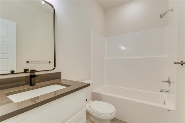 bathroom featuring toilet, bathtub / shower combination, and vanity