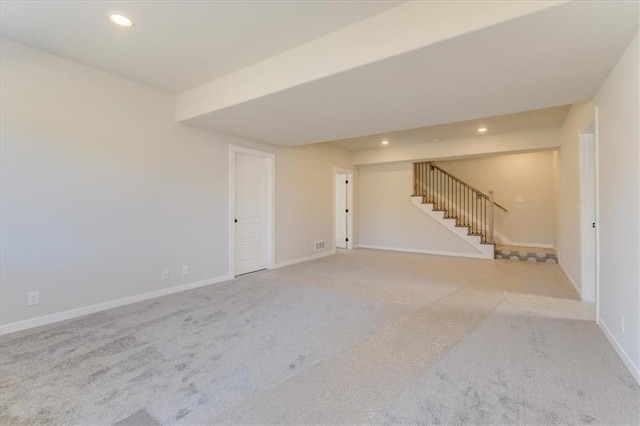 empty room with recessed lighting, carpet flooring, stairway, and baseboards