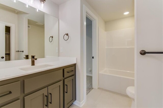 full bathroom featuring shower / washtub combination, recessed lighting, toilet, vanity, and tile patterned floors