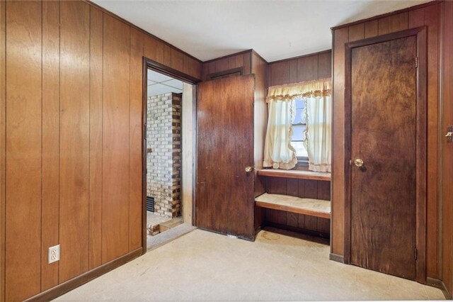 bedroom with wooden walls