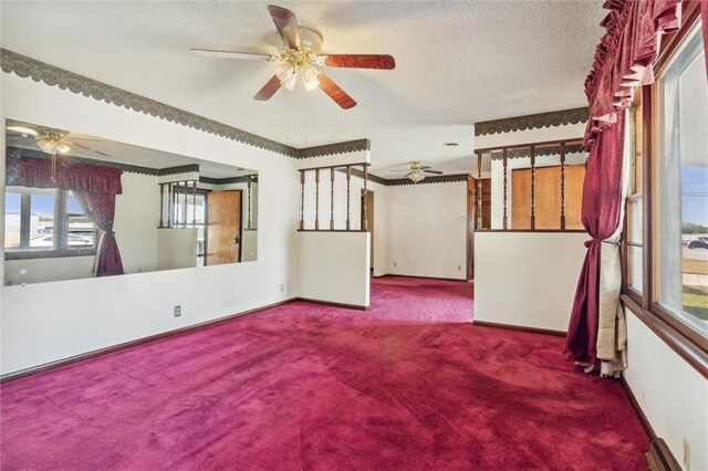 spare room with a textured ceiling, ceiling fan, and carpet floors