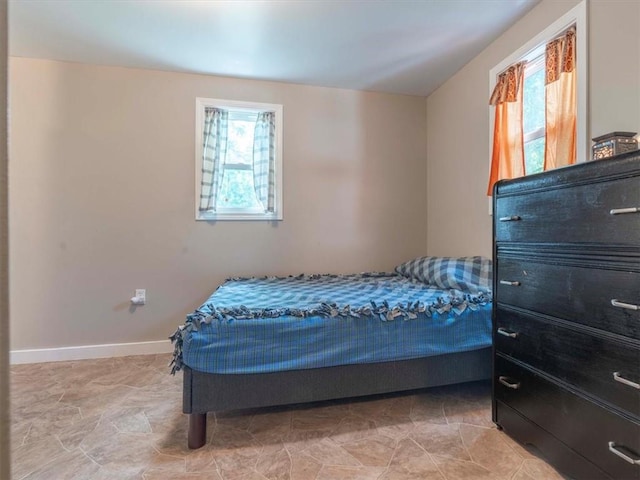 bedroom featuring light tile patterned floors