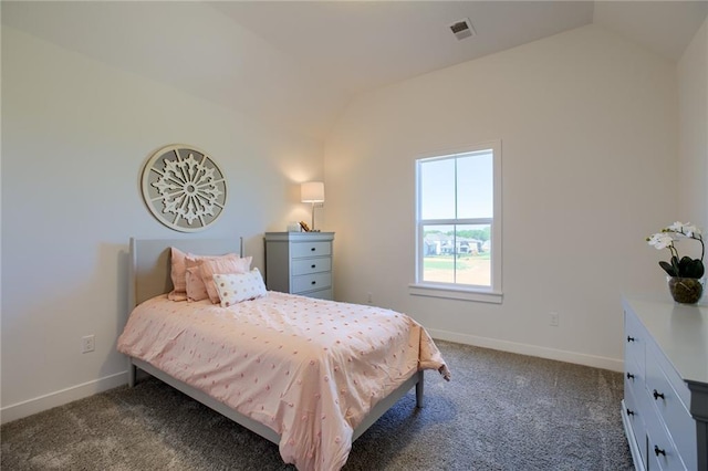 bedroom featuring dark carpet, baseboards, visible vents, and vaulted ceiling