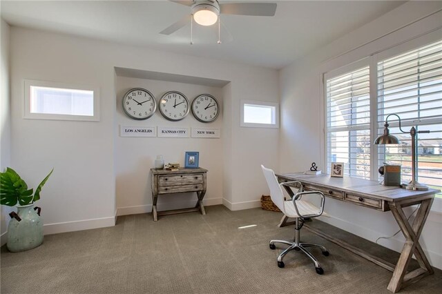 office featuring light carpet and ceiling fan