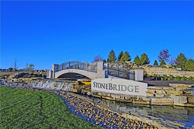 community sign with a water view