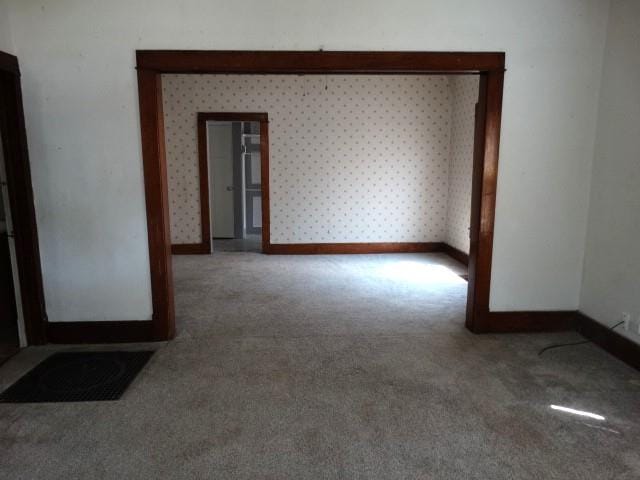 unfurnished room featuring carpet floors