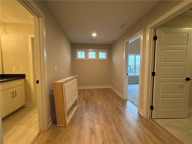 hallway featuring light hardwood / wood-style floors