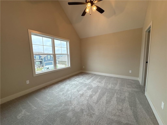 carpeted empty room featuring lofted ceiling and ceiling fan