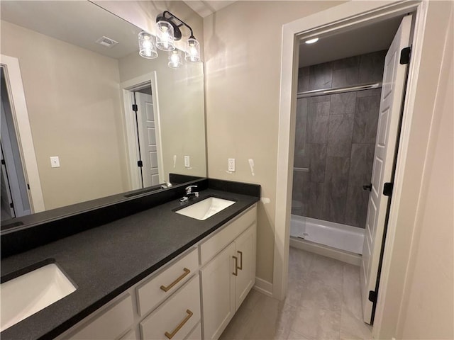 bathroom with vanity and a shower with shower door