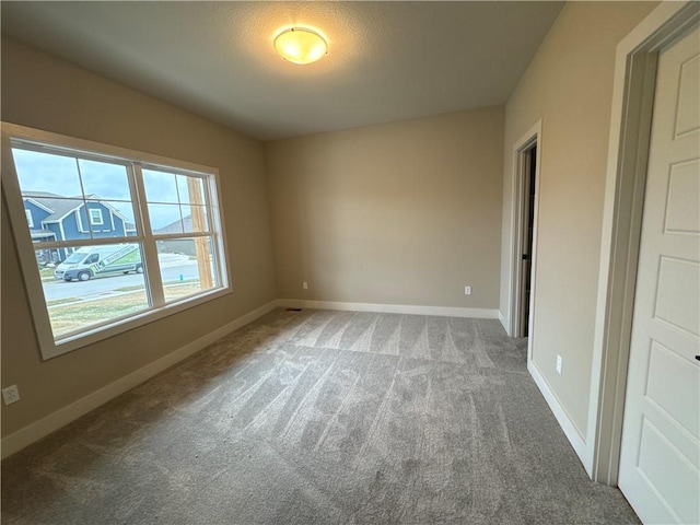 spare room featuring carpet flooring