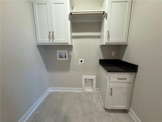 laundry area with cabinets, electric dryer hookup, and washer hookup