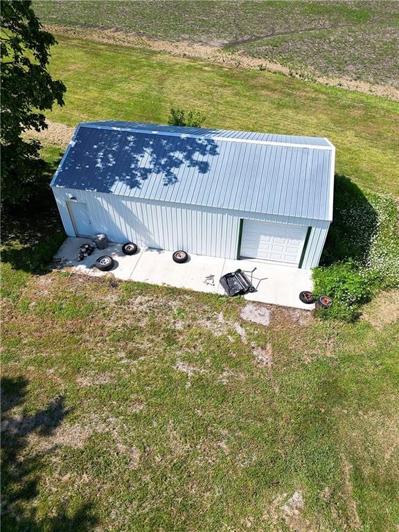 birds eye view of property with a rural view