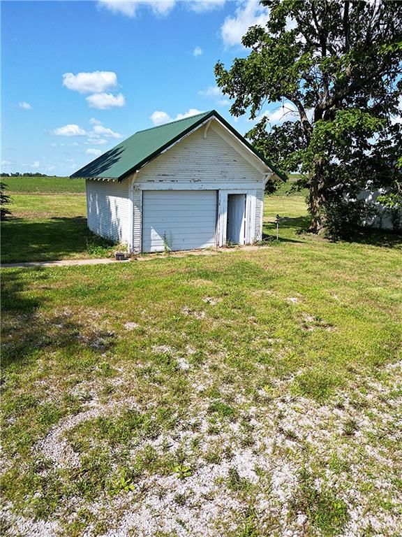 garage with a lawn