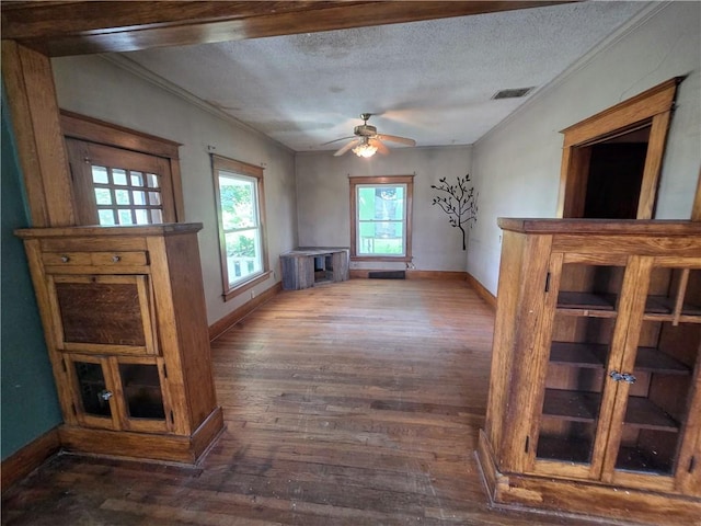 interior space featuring ceiling fan, hardwood / wood-style flooring, and a textured ceiling