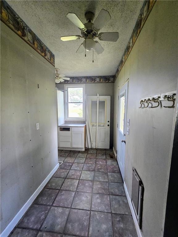 kitchen with tile patterned floors and ceiling fan