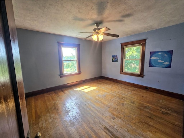 unfurnished room featuring ceiling fan and wood-type flooring